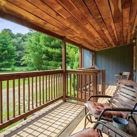 Covered front porch with rocking chairs at Owl Creek in Logan, Ohio